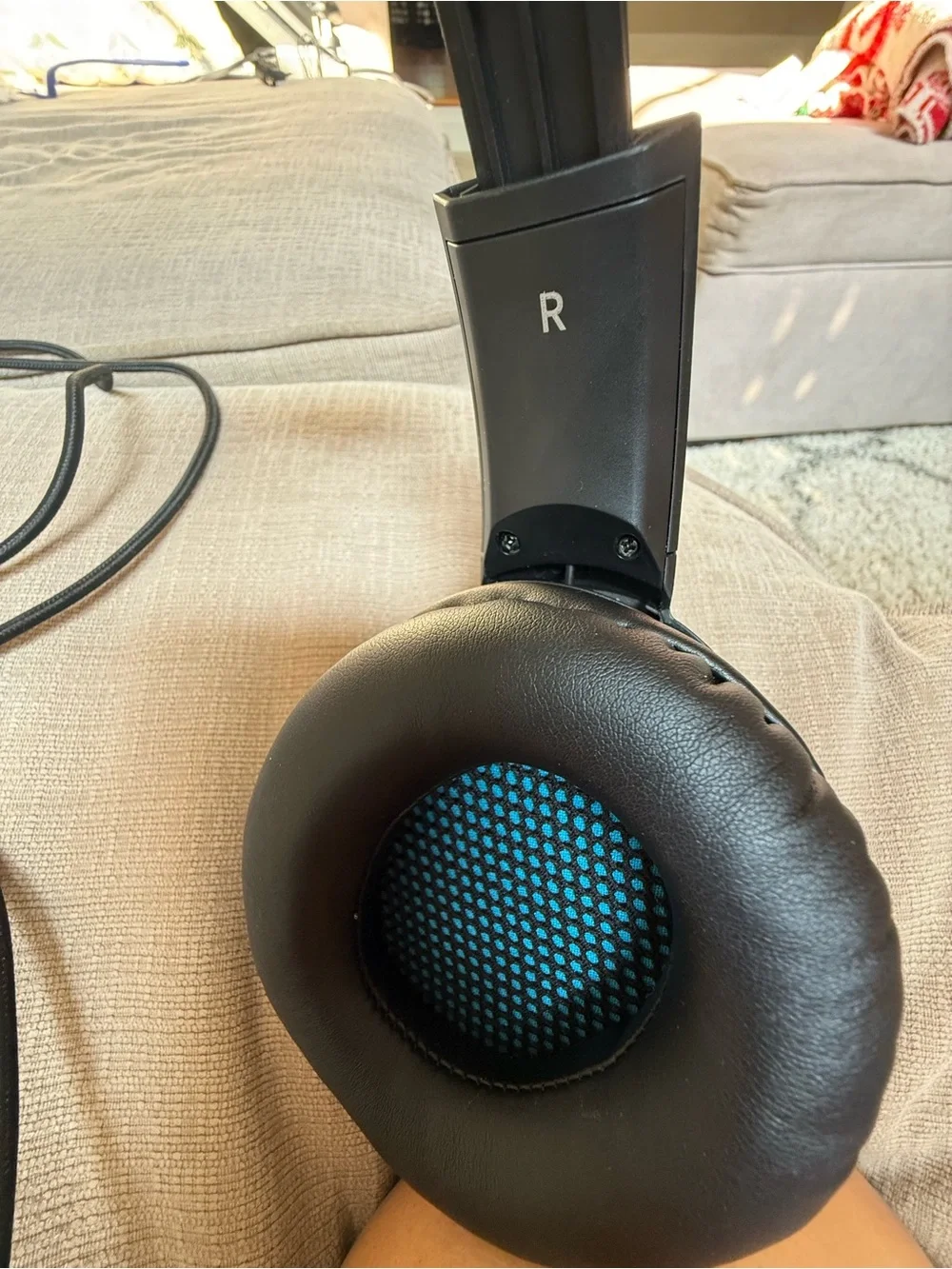 Black Over-Ear Gaming Headset with Blue Headband Accent